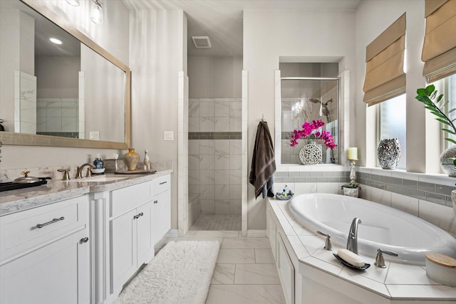 10874 Smoky Oak Trl, Flower Mound, TX 76226 - bathroom featuring marble look tile flooring, a garden tub, a tile shower, and vanity