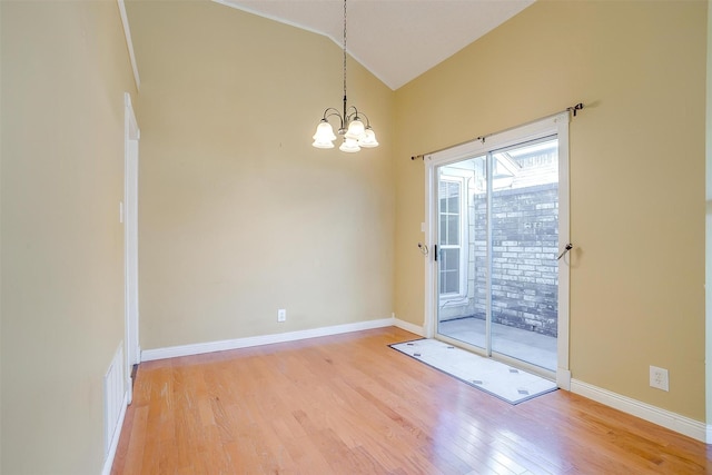 802 Greenridge Dr, Arlington, TX 76017 - unfurnished dining area featuring light wood finished floors, a chandelier, and high vaulted ceiling