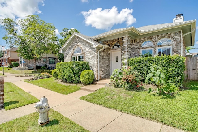 802 Greenridge Dr, Arlington, TX 76017 - view of front of house with a chimney and stone siding