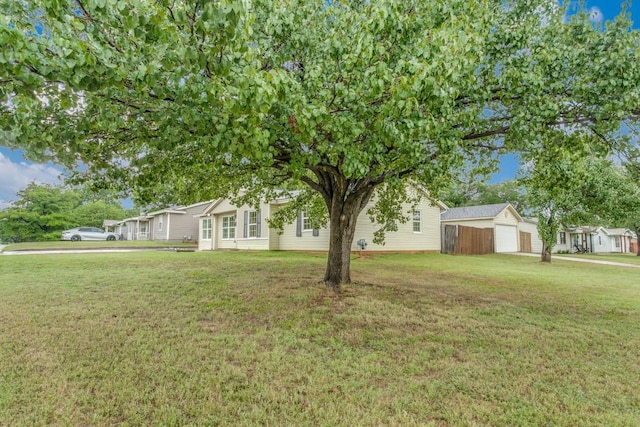 302 Lee Dr, Euless, TX 76039 - view of front of property featuring an outdoor structure, a front yard, and a garage