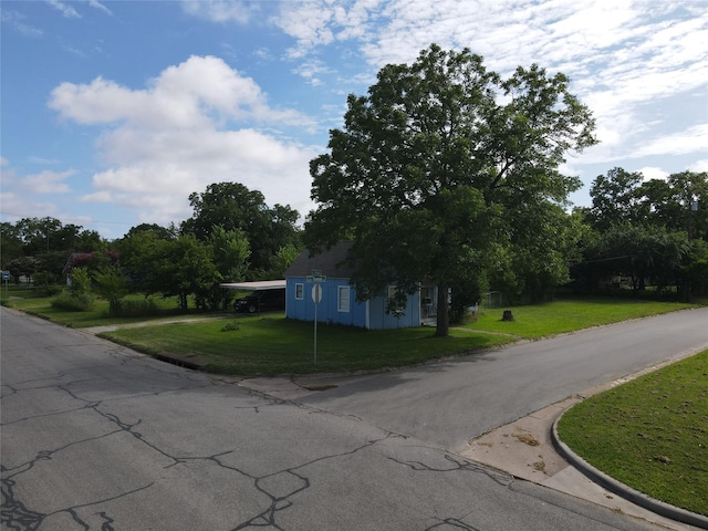 603 E Thomas St, Sherman, TX 75090 - view of asphalt road with curbs