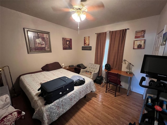 603 E Thomas St, Sherman, TX 75090 - bedroom featuring wood finished floors and ceiling fan