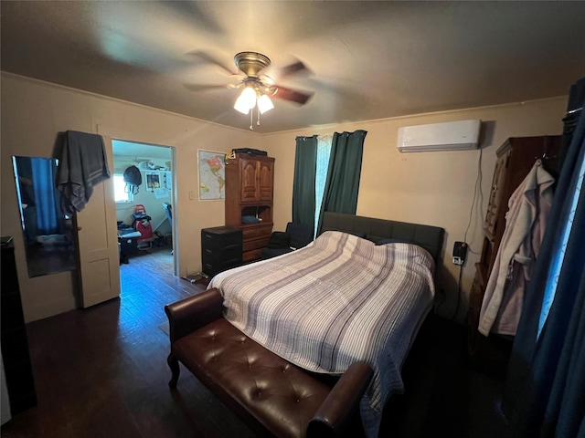 603 E Thomas St, Sherman, TX 75090 - bedroom with a wall unit AC, wood finished floors, and a ceiling fan
