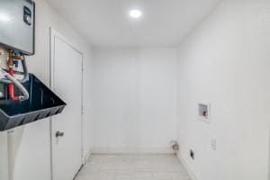 136 Edgefield Dr, Garland, TX 75040 - laundry area featuring washer hookup and baseboards