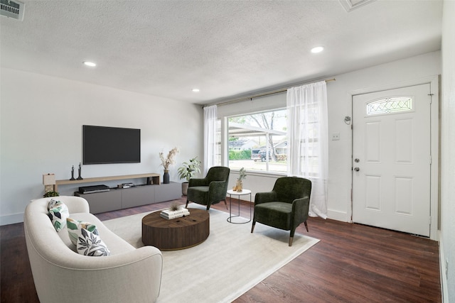 136 Edgefield Dr, Garland, TX 75040 - living area featuring wood finished floors, a textured ceiling, and recessed lighting