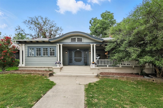 1000 W Hickory St, Denton, TX 76201 - view of front facade with covered porch and a front lawn