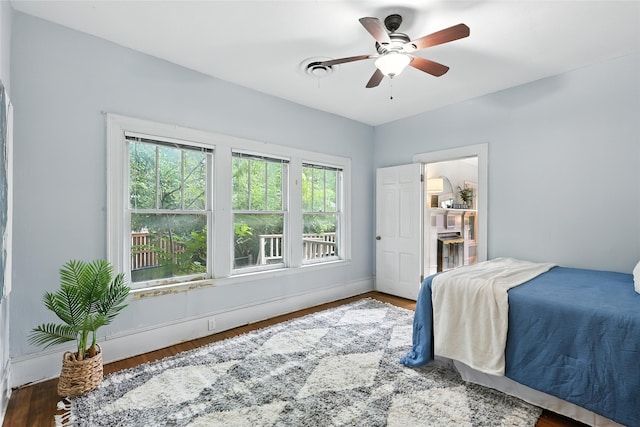 1000 W Hickory St, Denton, TX 76201 - bedroom featuring wood finished floors and a ceiling fan