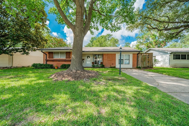 514 Fairview Dr, Richardson, TX 75081 - single story home featuring brick siding, a front yard, and driveway