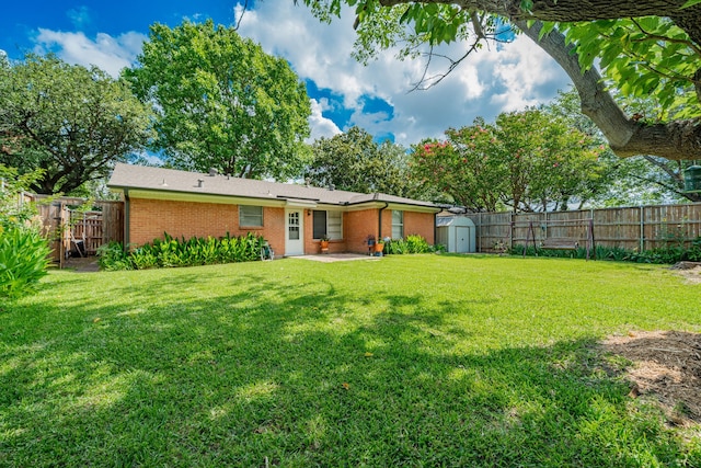 514 Fairview Dr, Richardson, TX 75081 - back of house featuring a shed, a patio area, a fenced backyard, and brick siding