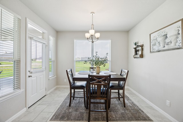 1001 Boulder Rd, Weatherford, TX 76085 - dining area with a chandelier and light tile patterned floors