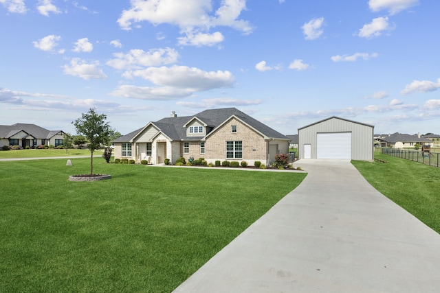 1001 Boulder Rd, Weatherford, TX 76085 - view of front of house with driveway, an outbuilding, a garage, and brick siding