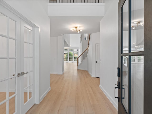 11342 Raveneaux Dr, Frisco, TX 75033 - foyer entrance featuring light wood-style floors, french doors, and stairway
