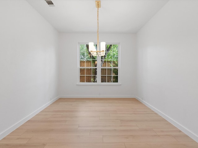 11342 Raveneaux Dr, Frisco, TX 75033 - unfurnished dining area with a chandelier and light wood-type flooring