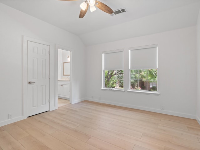 11342 Raveneaux Dr, Frisco, TX 75033 - unfurnished bedroom featuring light wood finished floors, vaulted ceiling, ensuite bath, and ceiling fan