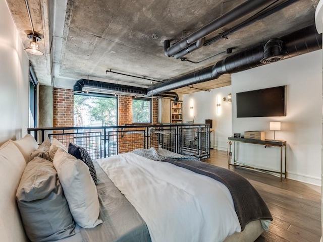 3110 Thomas Ave Unit 101, Dallas, TX 75204 - bedroom featuring baseboards and wood finished floors