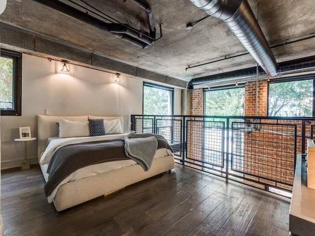 3110 Thomas Ave Unit 101, Dallas, TX 75204 - bedroom with hardwood / wood-style flooring and multiple windows