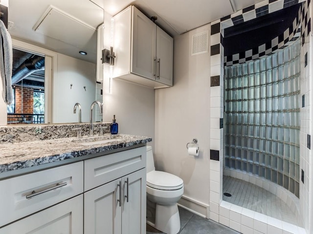 3110 Thomas Ave Unit 101, Dallas, TX 75204 - full bathroom featuring vanity, a shower stall, and tile patterned flooring