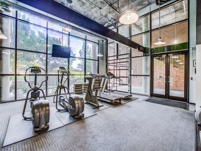 3110 Thomas Ave Unit 101, Dallas, TX 75204 - workout area featuring floor to ceiling windows, french doors, carpet flooring, and a high ceiling