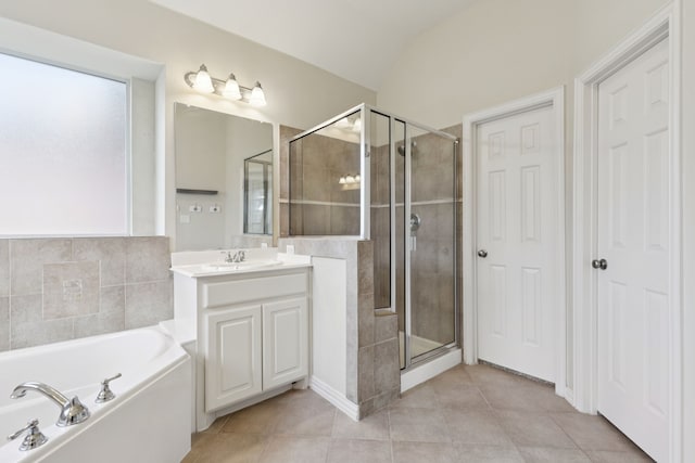 6802 Westfield Ct, Arlington, TX 76001 - full bath featuring a garden tub, a stall shower, vanity, tile patterned floors, and lofted ceiling