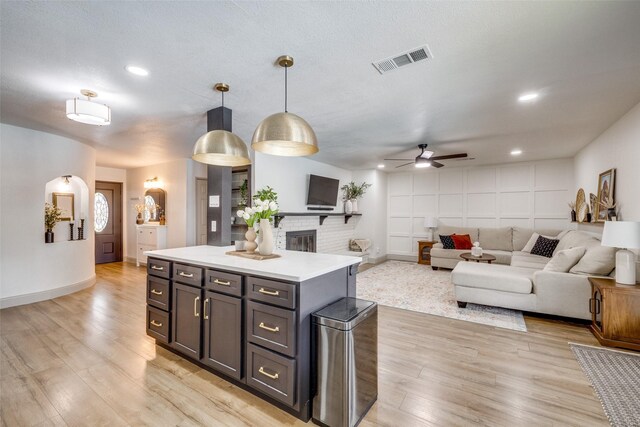 726 W Crossland Blvd, Grand Prairie, TX 75052 - kitchen with light wood-type flooring, a ceiling fan, light countertops, hanging light fixtures, and recessed lighting