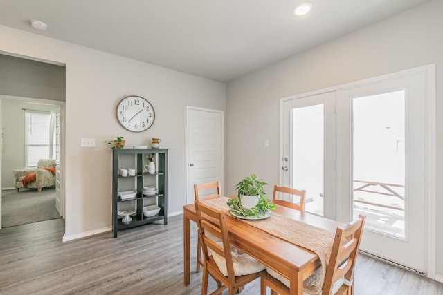 10041 Adams Ln, Providence Village, TX 76227 - dining space featuring light wood finished floors and recessed lighting