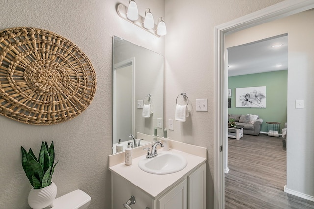 10041 Adams Ln, Providence Village, TX 76227 - bathroom with vanity and wood finished floors