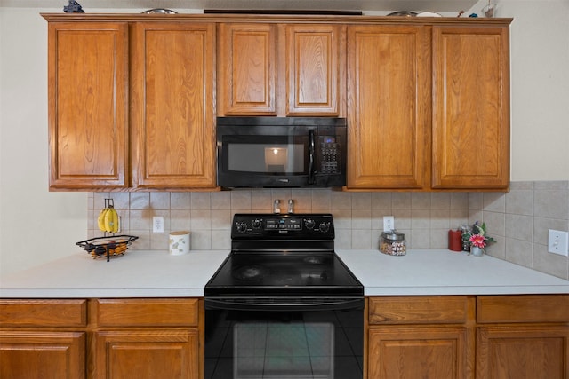 708 Hummingbird Trl, Crowley, TX 76036 - kitchen with black appliances, brown cabinetry, light countertops, and tasteful backsplash