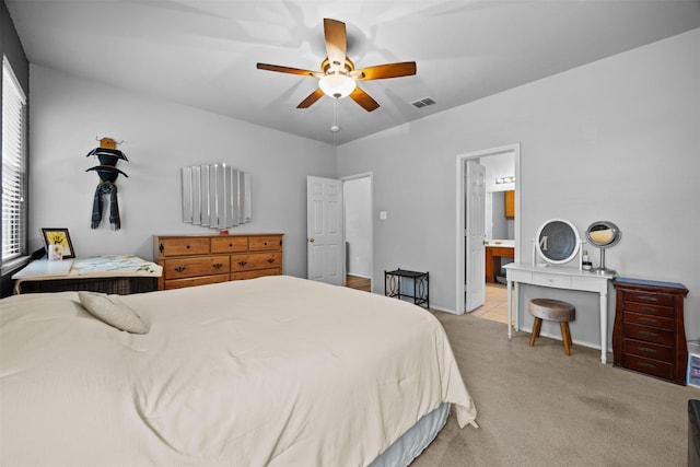708 Hummingbird Trl, Crowley, TX 76036 - bedroom with light colored carpet, a ceiling fan, and ensuite bath