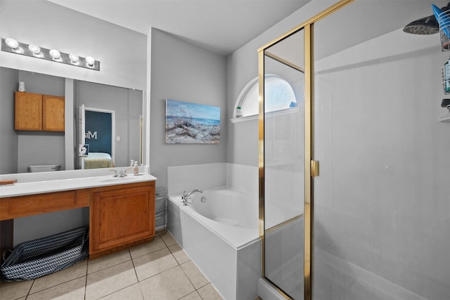 708 Hummingbird Trl, Crowley, TX 76036 - full bath with a garden tub, ensuite bathroom, a stall shower, vanity, and tile patterned flooring