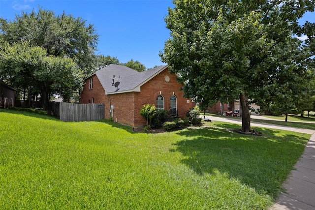 708 Hummingbird Trl, Crowley, TX 76036 - view of side of property with brick siding and roof with shingles