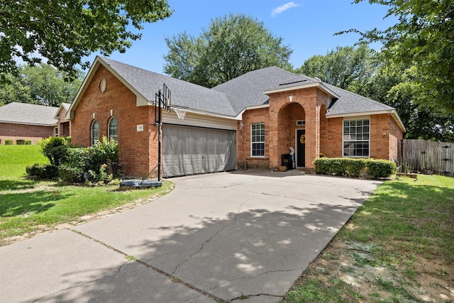 708 Hummingbird Trl, Crowley, TX 76036 - traditional-style home featuring brick siding, an attached garage, roof with shingles, and concrete driveway