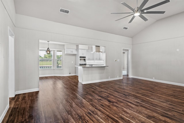 8441 Main St, North Richland Hills, TX 76182 - unfurnished living room featuring dark wood-type flooring, a ceiling fan, and high vaulted ceiling