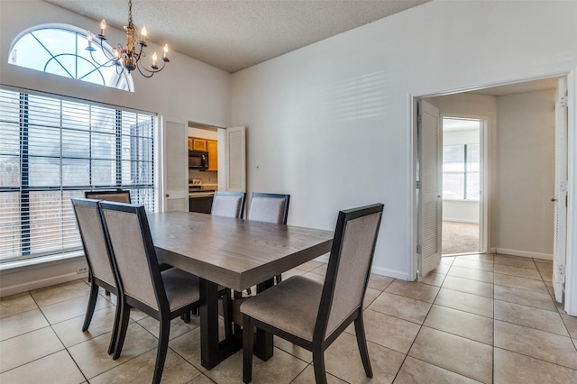 6720 Cedar Forest Trl, Dallas, TX 75236 - dining room featuring a chandelier, light tile patterned floors, and a textured ceiling