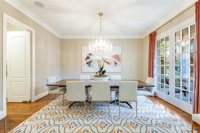 3517 Haynie Ave, University Park, TX 75205 - dining area with a chandelier, wood finished floors, and ornamental molding