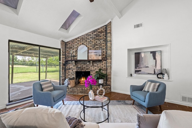 3509 Ames Rd, Lancaster, TX 75134 - living area with a skylight, a brick fireplace, high vaulted ceiling, and beamed ceiling