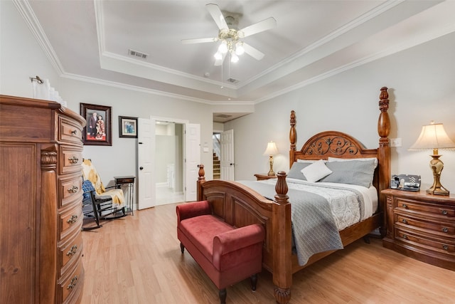 537 Estate Dr, Grand Prairie, TX 75052 - bedroom with a raised ceiling, light wood finished floors, crown molding, ensuite bath, and a ceiling fan