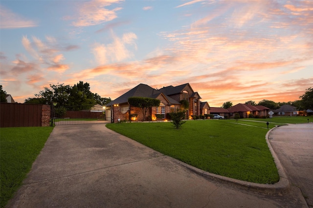 537 Estate Dr, Grand Prairie, TX 75052 - view of front facade featuring concrete driveway and a gate