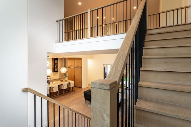 3815 Dunhaven Rd, Dallas, TX 75220 - stairs with a towering ceiling and wood finished floors