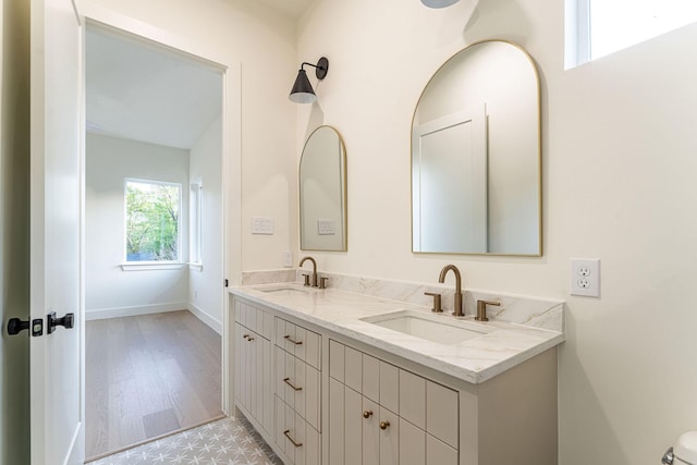 3815 Dunhaven Rd, Dallas, TX 75220 - bathroom featuring double vanity and wood finished floors