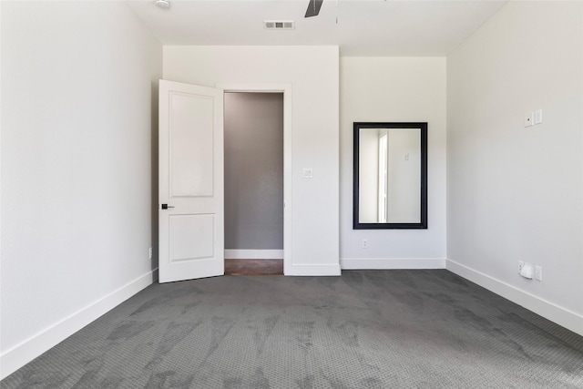 15321 Mount Evans Dr, Little Elm, TX 75068 - unfurnished bedroom with dark colored carpet and a ceiling fan