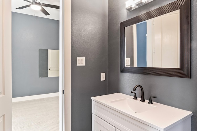 15321 Mount Evans Dr, Little Elm, TX 75068 - bathroom featuring ceiling fan, vanity, and a textured wall