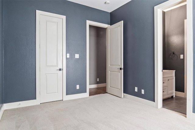 15321 Mount Evans Dr, Little Elm, TX 75068 - unfurnished bedroom with carpet flooring, ensuite bath, and a textured wall