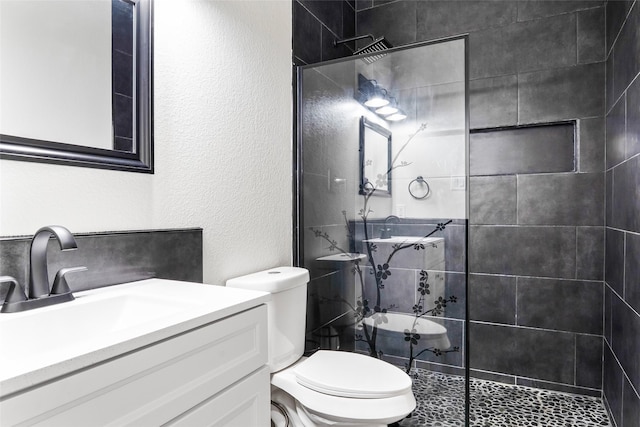 15321 Mount Evans Dr, Little Elm, TX 75068 - bathroom with a tile shower, vanity, and a textured wall