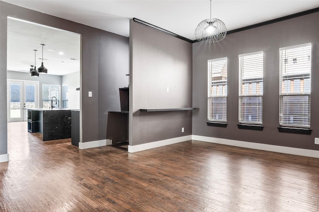 15321 Mount Evans Dr, Little Elm, TX 75068 - empty room featuring dark wood finished floors and crown molding