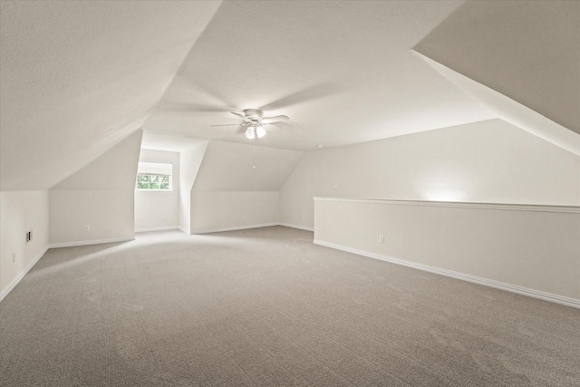 1036 E Oaklawn Dr, Talty, TX 75160 - bonus room featuring carpet floors, lofted ceiling, and ceiling fan