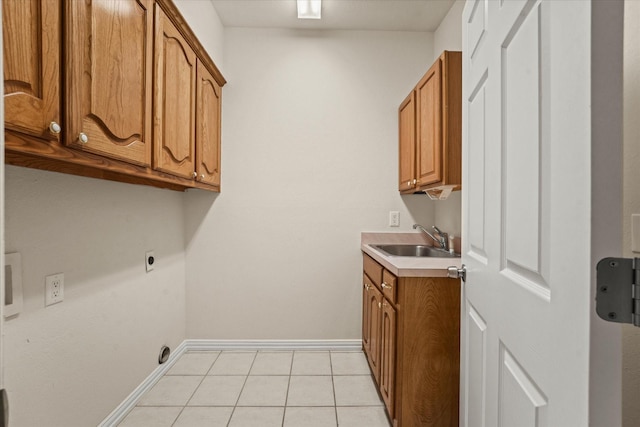 1036 E Oaklawn Dr, Talty, TX 75160 - washroom featuring hookup for an electric dryer, cabinet space, and light tile patterned floors