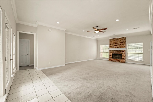 1036 E Oaklawn Dr, Talty, TX 75160 - unfurnished living room with light colored carpet, a ceiling fan, a fireplace, ornamental molding, and light tile patterned floors