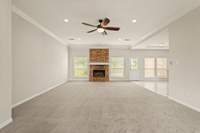1036 E Oaklawn Dr, Talty, TX 75160 - unfurnished living room with light colored carpet, healthy amount of natural light, ceiling fan, crown molding, and a brick fireplace
