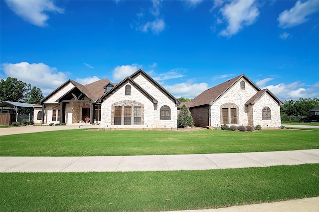 1702 High Point Dr, Pilot Point, TX 76258 - french country inspired facade featuring stone siding and a front lawn