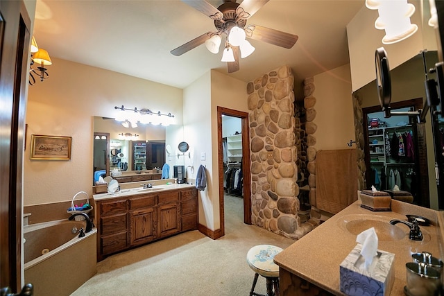 1702 High Point Dr, Pilot Point, TX 76258 - full bath with vanity, a bath, ceiling fan, lofted ceiling, and a spacious closet